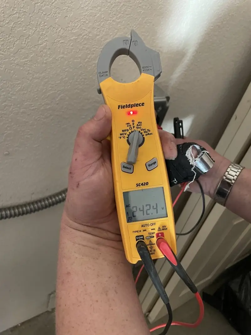 Voltage testing with clamp meter during Generator Installation in Edinburg